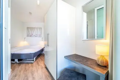 Ein Bett oder Betten in einem Zimmer der Unterkunft Promenadenvilla 03 Wohnung 02