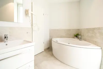Ein Badezimmer in der Unterkunft Promenadenvilla 03 Wohnung 01