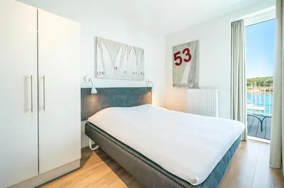 Ein Bett oder Betten in einem Zimmer der Unterkunft Promenadenvilla 03 Wohnung 11