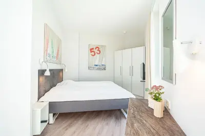Ein Bett oder Betten in einem Zimmer der Unterkunft Promenadenvilla 03 Wohnung 11