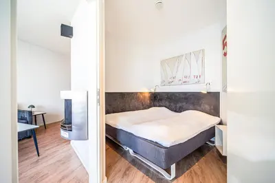 Ein Bett oder Betten in einem Zimmer der Unterkunft Promenadenvilla 03 Wohnung 05