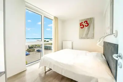 Ein Bett oder Betten in einem Zimmer der Unterkunft Promenadenvilla 03 Wohnung 09