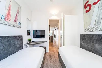 Ein Bett oder Betten in einem Zimmer der Unterkunft Promenadenvilla 03 Wohnung 04