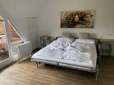 Ein Bett oder Betten in einem Zimmer der Unterkunft PEMATRA FeWo Kleine Brise