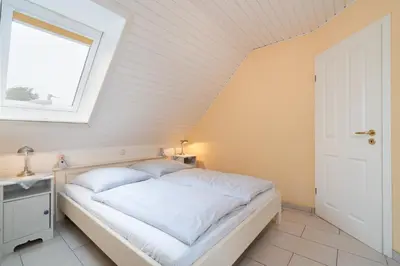 Ein Bett oder Betten in einem Zimmer der Unterkunft Ferienwohnung 