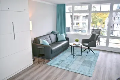 Ein Sitzbereich in der Unterkunft Strandhotel Appartement Nr 34 Sünnkant