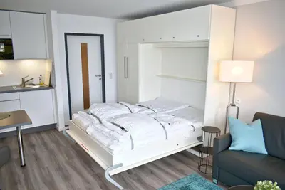 Ein Bett oder Betten in einem Zimmer der Unterkunft Strandhotel Appartement Nr 34 Sünnkant
