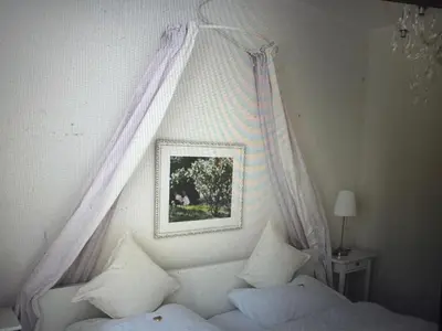 Ein Bett oder Betten in einem Zimmer der Unterkunft Kapitänshaus