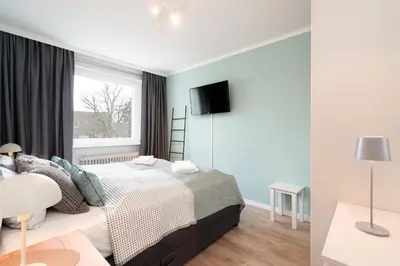 Ein Bett oder Betten in einem Zimmer der Unterkunft StrandPause 52