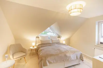 Ein Bett oder Betten in einem Zimmer der Unterkunft NEU Hütthus Ferienhaus in Timmendorfer Strand