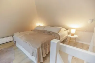 Ein Bett oder Betten in einem Zimmer der Unterkunft NEU Hütthus Ferienhaus in Timmendorfer Strand