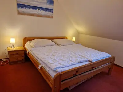 Ein Bett oder Betten in einem Zimmer der Unterkunft Fewo Sonnensee II Haffkrug Aalweg 28