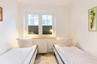 Ein Bett oder Betten in einem Zimmer der Unterkunft Ferienwohnung Logenplatz Timmendorfer Strand