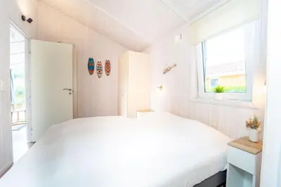 Ein Bett oder Betten in einem Zimmer der Unterkunft Freibeuterweg - Dorf 6 Ferienhaus 14