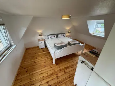 Ein Bett oder Betten in einem Zimmer der Unterkunft Möwennest