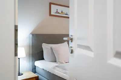 Ein Bett oder Betten in einem Zimmer der Unterkunft Gorch-Fock-Park Ferienwohnung 