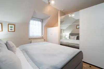 Ein Bett oder Betten in einem Zimmer der Unterkunft Gorch-Fock-Park Ferienwohnung 