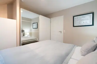 Ein Bett oder Betten in einem Zimmer der Unterkunft Gorch-Fock-Park Ferienwohnung 