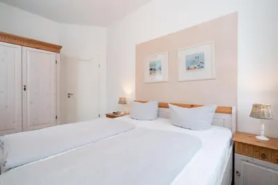 Ein Bett oder Betten in einem Zimmer der Unterkunft Strandperle No 22
