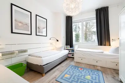Ein Bett oder Betten in einem Zimmer der Unterkunft Strandperle No 22