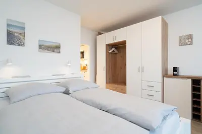 Ein Bett oder Betten in einem Zimmer der Unterkunft Strandläufer