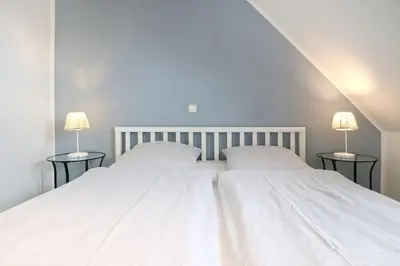 Ein Bett oder Betten in einem Zimmer der Unterkunft Meerzeit Doppelhaushälfte