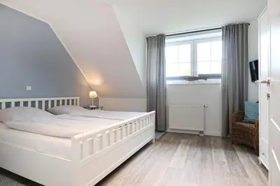 Ein Bett oder Betten in einem Zimmer der Unterkunft Meerzeit Doppelhaushälfte