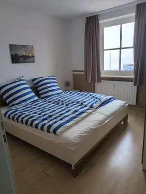 Ein Bett oder Betten in einem Zimmer der Unterkunft Fabelhaft am Meer