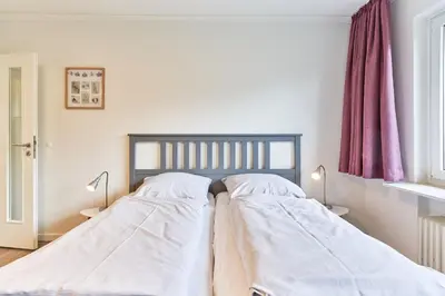 Ein Bett oder Betten in einem Zimmer der Unterkunft Haus SeeZeit Appartement 03