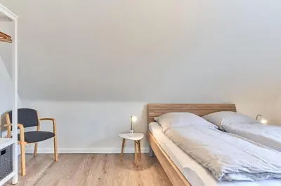 Ein Bett oder Betten in einem Zimmer der Unterkunft Haus SeeZeit Appartement 08