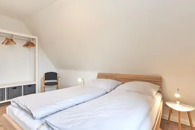 Ein Bett oder Betten in einem Zimmer der Unterkunft Haus SeeZeit Appartement 08