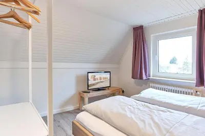 Ein Bett oder Betten in einem Zimmer der Unterkunft Haus SeeZeit Appartement 09