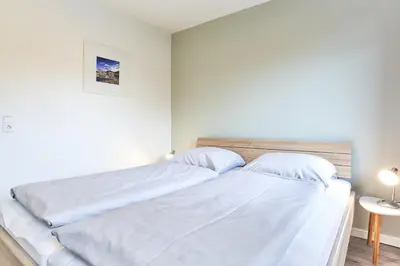 Ein Bett oder Betten in einem Zimmer der Unterkunft Haus SeeZeit Appartement 05