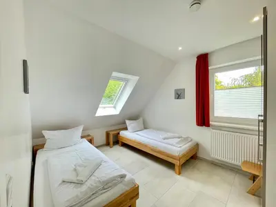Ein Bett oder Betten in einem Zimmer der Unterkunft Meerblick