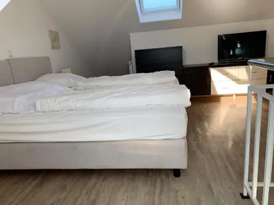 Ein Bett oder Betten in einem Zimmer der Unterkunft Strandoase Sierksdorf Strandoase Meeresbrise