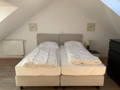 Ein Bett oder Betten in einem Zimmer der Unterkunft Strandoase Sierksdorf Strandoase Meeresbrise