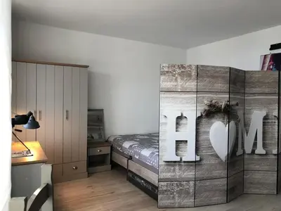 Ein Bett oder Betten in einem Zimmer der Unterkunft Panoramic Sierksdorf Meer Loft