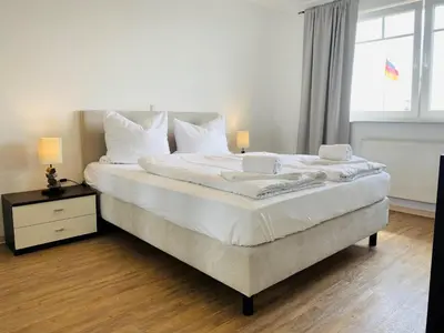 Ein Bett oder Betten in einem Zimmer der Unterkunft Strandoase Sierksdorf Strandoase Strandmuschel