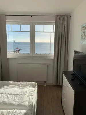 Ein Bett oder Betten in einem Zimmer der Unterkunft Strandoase Sierksdorf Strandoase Strandmuschel