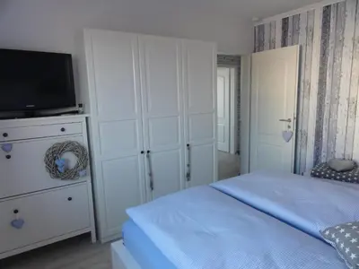Ein Bett oder Betten in einem Zimmer der Unterkunft Strandschlösschen Utkiek