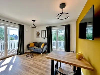 TV/Unterhaltungsangebot in der Unterkunft Salt & Sand Haffkrug Salt & Sand Wohnung Sun