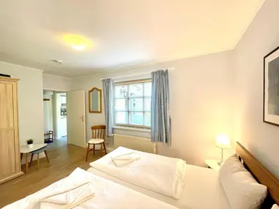 Ein Bett oder Betten in einem Zimmer der Unterkunft Kiek ut