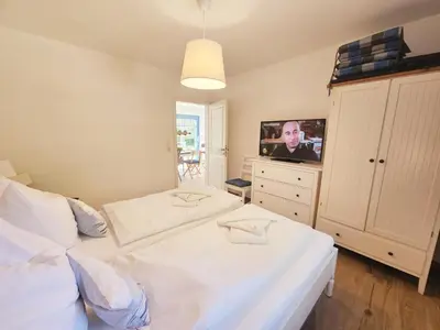Ein Bett oder Betten in einem Zimmer der Unterkunft Haus Schiffchen