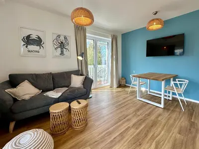 TV/Unterhaltungsangebot in der Unterkunft Salt & Sand Haffkrug Salt & Sand Wohnung Sea