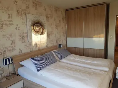 Ein Bett oder Betten in einem Zimmer der Unterkunft Strandresidenz Sierksdorf Strandresidenz Ankerplatz