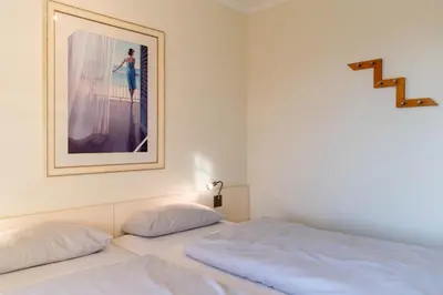Ein Bett oder Betten in einem Zimmer der Unterkunft Moderne Kurparkresidenz Whg. 12