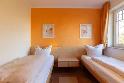 Ein Bett oder Betten in einem Zimmer der Unterkunft Ferienwohnung Moderne Kurparkresidenz Whg. 9