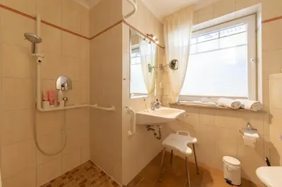 Ein Badezimmer in der Unterkunft Ferienwohnung Moderne Kurparkresidenz Whg. 9