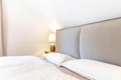 Ein Bett oder Betten in einem Zimmer der Unterkunft Ferienwohnung Lütt Strandhuus - Scharbeutz