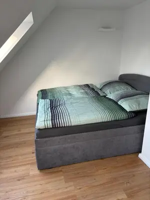 Ein Bett oder Betten in einem Zimmer der Unterkunft Ferienhaus Wesloer Landstraße 6b
